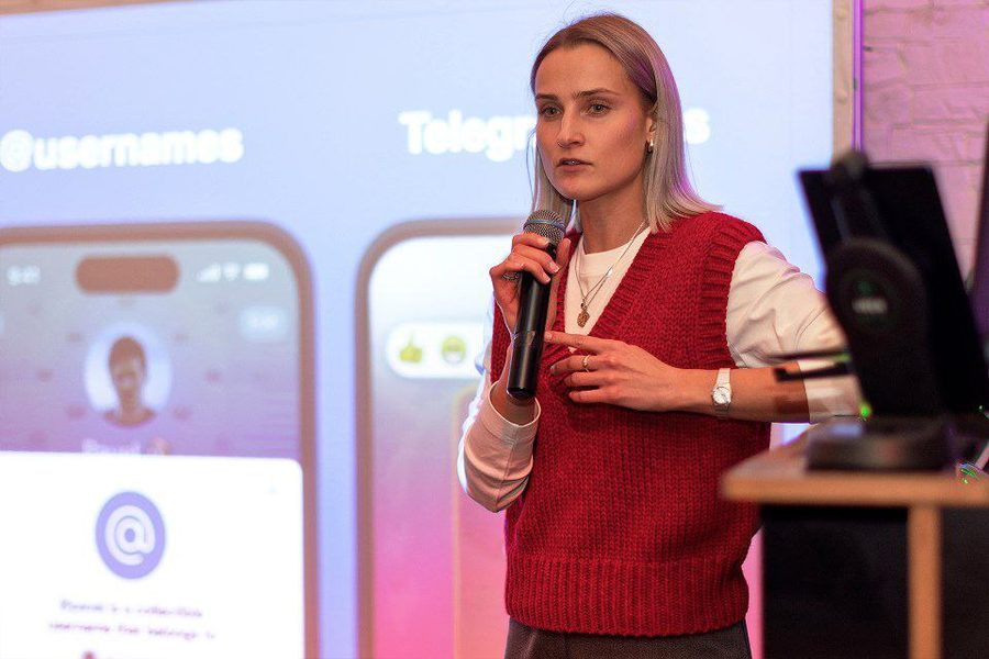 Sofia speaking on stage, representing Open Builders